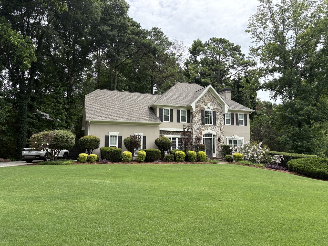 Sculpted shrubs and lawn from the street